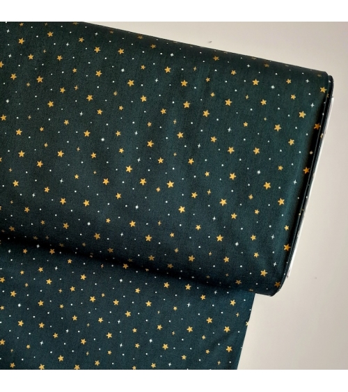 Tela japonesa de estrellitas doradas sobre fondo verde abeto
