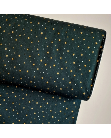 Tela japonesa de estrellitas doradas sobre fondo verde abeto