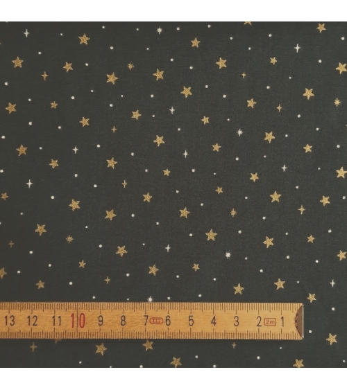Tela japonesa de estrellitas doradas sobre fondo verde abeto