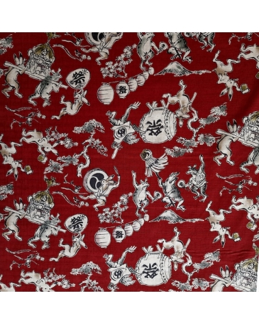 Tela japonesa "Choju-giga" con fondo rojo guinda, en dobby de algodón 100%.