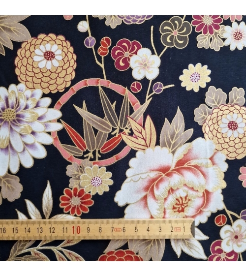 Japanese fabric 'Flowers and bamboo' in autumn colours on black.