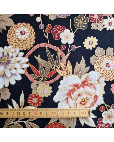 Japanese fabric 'Flowers and bamboo' in autumn colours on black.