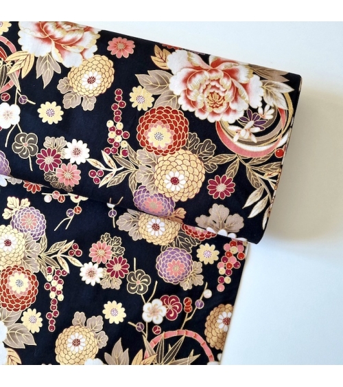 Japanese fabric 'Flowers and bamboo' in autumn colours on black.