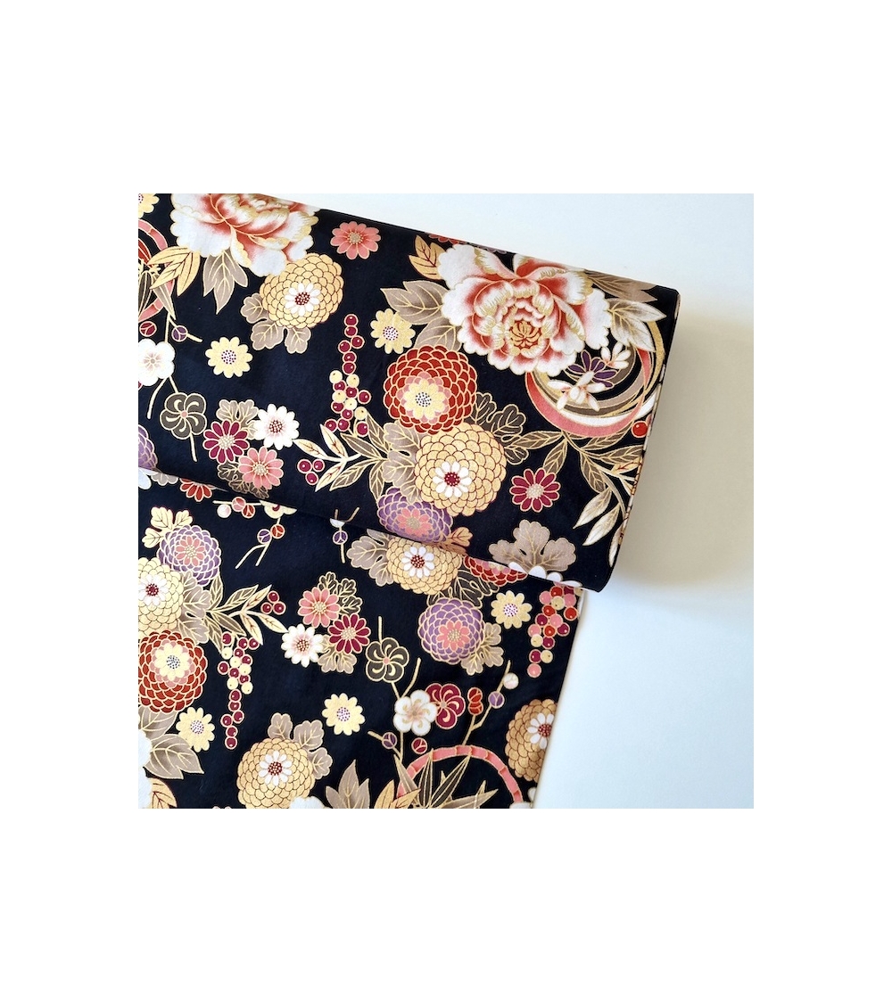 Japanese fabric 'Flowers and bamboo' in autumn colours on black.