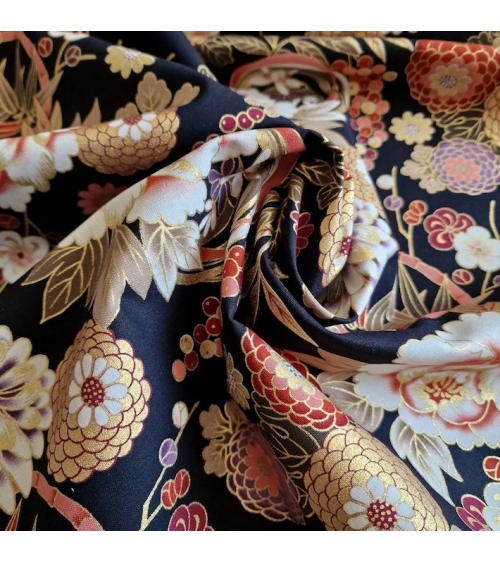 Japanese fabric 'Flowers and bamboo' in autumn colours on black.