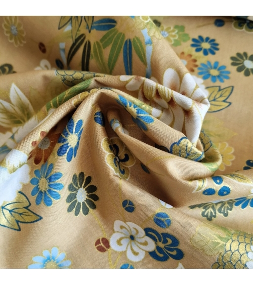 Japanese fabric 'Flowers and bamboo' in bluish colours on tan.
