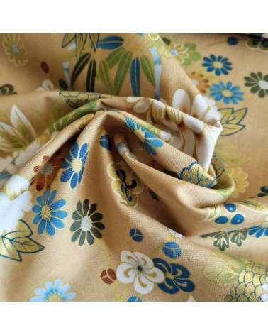 Japanese fabric 'Flowers and bamboo' in bluish colours on tan.