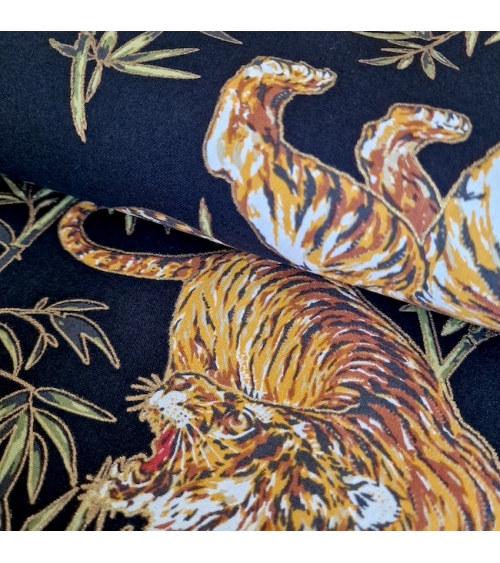 Japanese cotton fabric 'Tigers and bamboo', with golden highlights, in black.