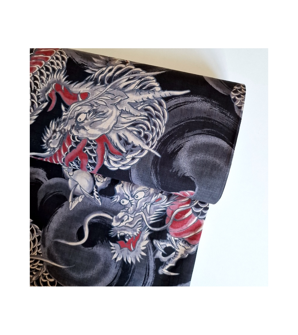 Japanese dobby fabric with large dragons in black.