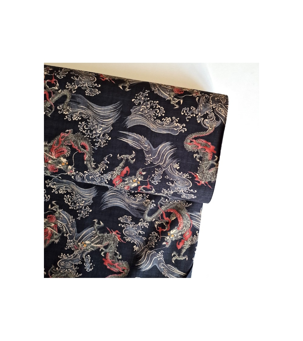 Japanese dobby fabric with small dragons and waves in black.