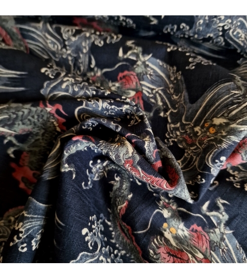 Japanese dobby fabric with small dragons and waves in black.