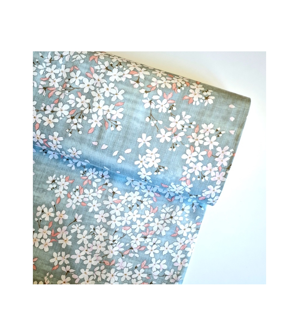 Japanese fabric "Sakuras" with aqua background, in cotton dobby.