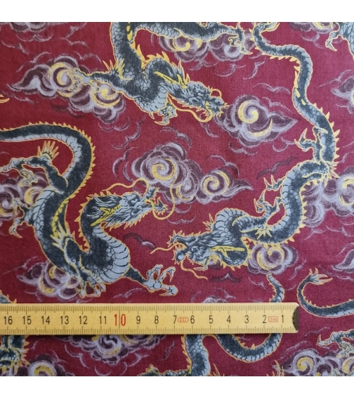 Japanese fabric 'Flying dragons' in burgundy red. 100% cotton.