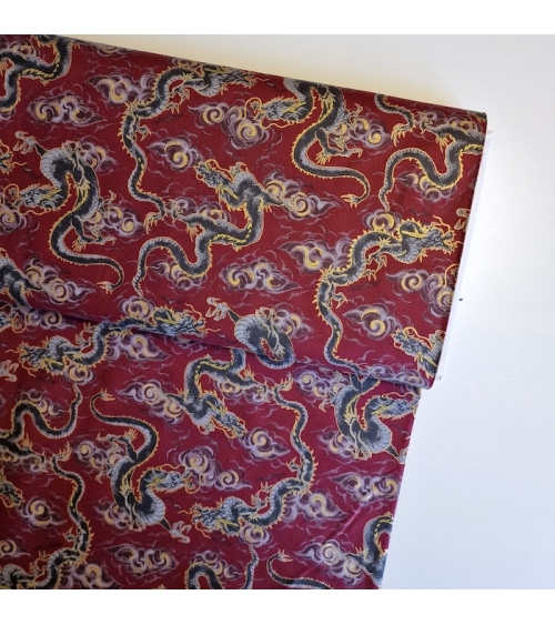 Japanese fabric 'Flying dragons' in burgundy red. 100% cotton.