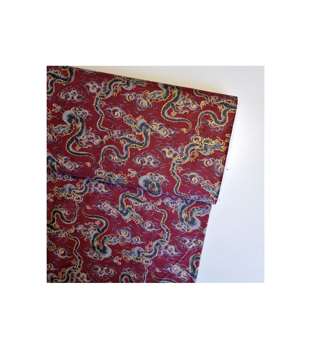 Japanese fabric 'Flying dragons' in burgundy red. 100% cotton.