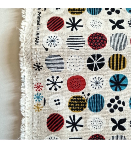 apanese canvas with coloured circles and Nordic motifs on an ivory background