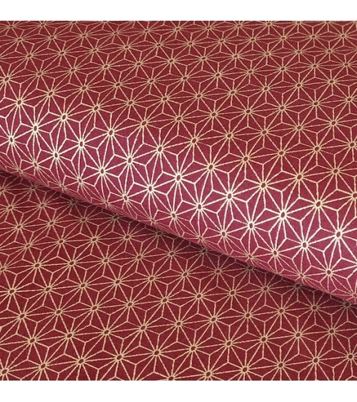 Japanese cotton fabric with golden asanohas over maroon
