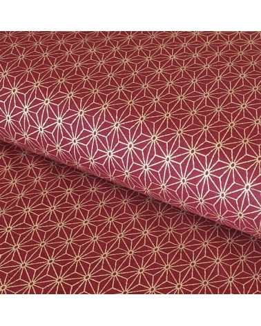Japanese cotton fabric with golden asanohas over maroon